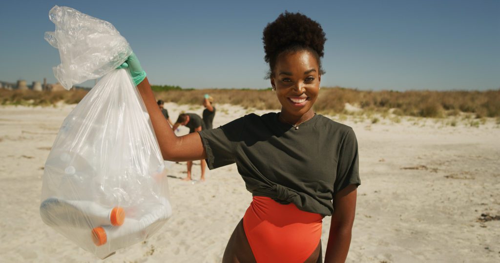 Volunteer Collecting Plastic Litter